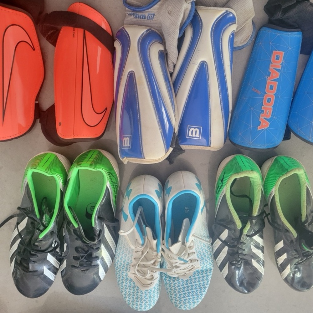 Soccer cleats with shin pads